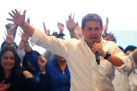 Honduras President and National Party candidate Juan Orlando Hernandez celebrates with supporters as he cited exit polls to declare himself winner in the presidential election in Tegucigalpa, Honduras, November 26, 2017. REUTERS/Edgard Garrido