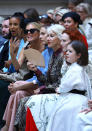 Helen Mirren, Karen Elson and Sinead Burke wait for the show to start [Photo: Getty]