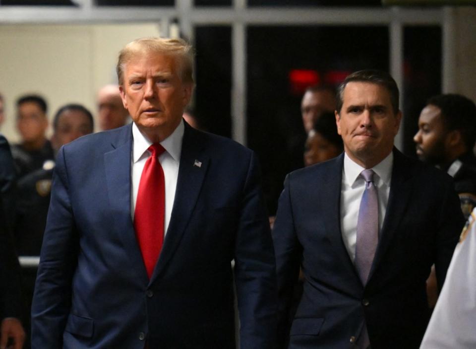 Former US President Donald Trump, with his lawyer Todd Blanche. AFP via Getty Images