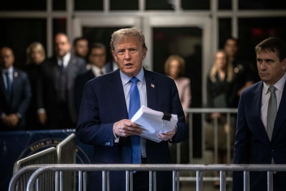 APRIL 26, 2024 - NEW YORK, NY: Former President Donald Trump, charged with falsifying 34 business records in an attempt to cover up a payment to adult film actress Stormy Daniels, speaks to reporters alongside his attorney Todd Blanche, right, during his ongoing trial at Manhattan Criminal Court, 100 Centre St. in Lower Manhattan, April 26, 2024.
