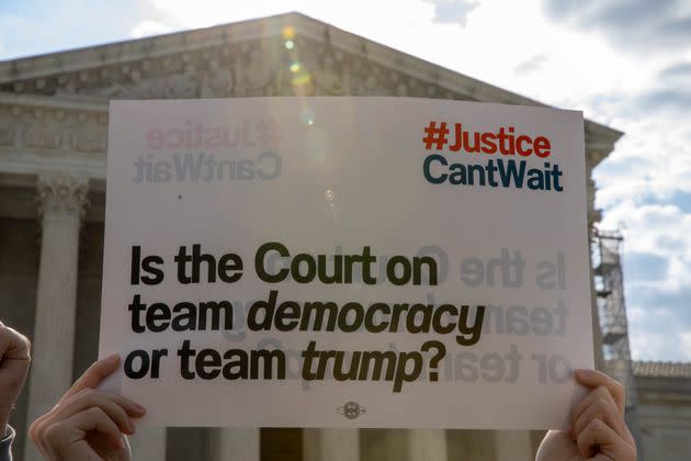 Protesters gathered outside the Supreme Court as it heard arguments Thursday on former President Donald Trump's claim of 