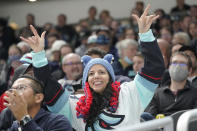 A Seattle Kraken fan cheers near the end of the third period of an NHL hockey game against the Montreal Canadiens, Tuesday, Oct. 26, 2021, in Seattle. The Kraken won 5-1. (AP Photo/Ted S. Warren)