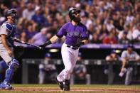Sep 8, 2018; Denver, CO, USA; Colorado Rockies center fielder Charlie Blackmon (19) hits a two run home run in the fifth inning against the Los Angeles Dodgers at Coors Field. Mandatory Credit: Ron Chenoy-USA TODAY Sports