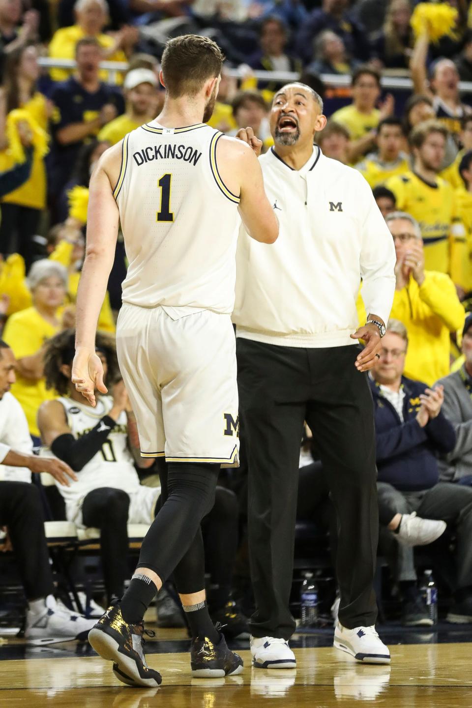 Michigan head coach Juwan Howard talks to center Hunter Dickinson (1) after a play against Nebraska during the second half at Crisler Center in Ann Arbor on Wednesday, Feb. 8, 2023.