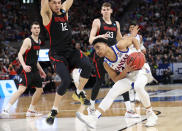 <p>Devon Dotson #11 of the Kansas Jayhawks handles the ball against Jordan Roland #12 of the Northeastern Huskies during the second half in the first round of the 2019 NCAA Men’s Basketball Tournament at Vivint Smart Home Arena on March 21, 2019 in Salt Lake City, Utah. </p>