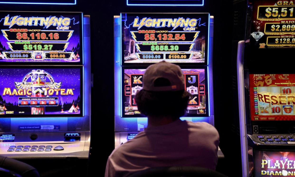 <span>The increase in gambling losses has mostly been driven by gaming, up 19.6% from $19.3bn in 2021-22 to $23bn in 2022-23.</span><span>Photograph: Loren Elliott/Reuters</span>