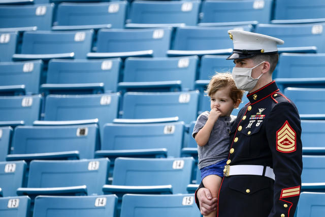 JACKSONVILLE, FLORIDA - NOVEMBER 08: General view of a US Marine looking on while holding a child prior to the game between the Jacksonville Jaguars and the Houston Texans at TIAA Bank Field on November 08, 2020 in Jacksonville, Florida. (Photo by Douglas P. DeFelice/Getty Images)