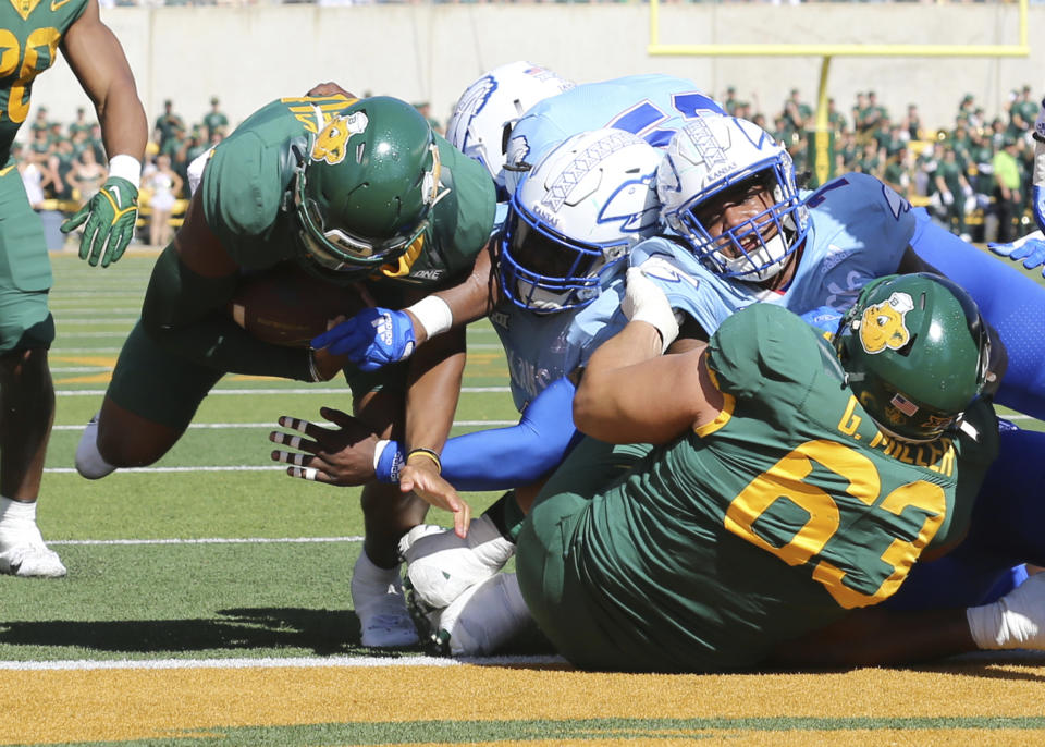 Baylor quarterback Kyron Drones, left, scores a touchdown against Kansas \ in the first half of an NCAA college football game, Saturday, Oct. 22, 2022, in Waco, Texas. (AP Photo/Jerry Larson)