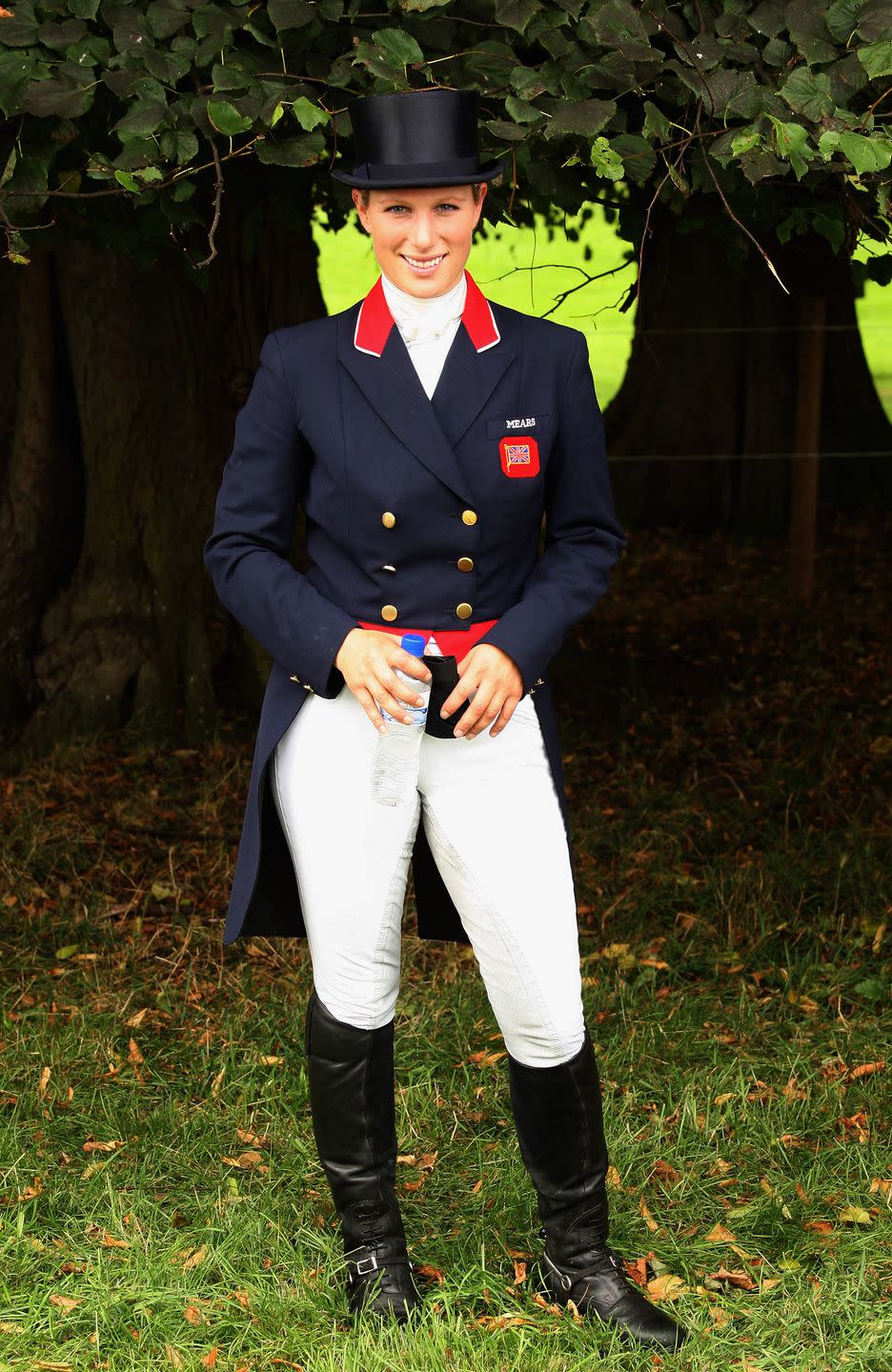 Uniform, English riding, Riding boot, Footwear, Recreation, Equestrianism, Outerwear, Dressage, Equestrian helmet, Formal wear, 