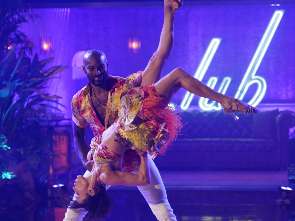 Tyson Beckford and Jenna Johnson dancing salsa.