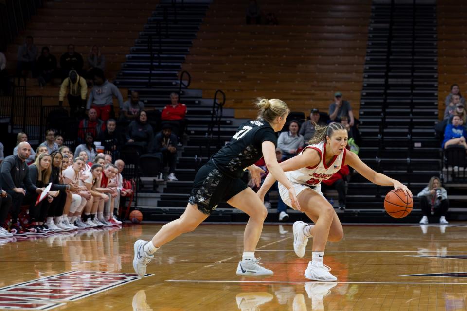 Marist's Catie Cunningham drives against an Army defender during a Nov. 9, 2023 women's basketball game.