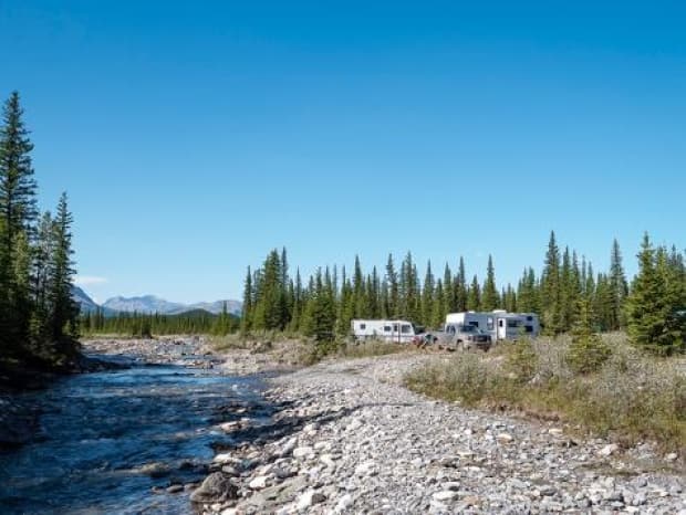 A camp set up too close to Waiperous Creek during the summer of 2020, when Alberta saw increased interest in Crown land camping. The province is planning to introduce fees for those camping on public land.  (Ghost Watershed Alliance Society - image credit)