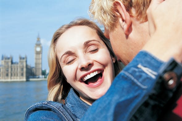 Couple outside the Houses of Parliament and Big Ben, London, EnglandCity, Vacations, Travel Destinations, Horizontal, Waist Up