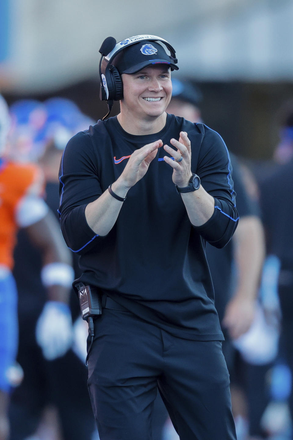 Boise State head coach Spencer Danielson claps after a 75 yard touchdown run by running back Ashton Jeanty (2) against Utah State in the first half of an NCAA college football game, Saturday, Oct. 5, 2024, in Boise, Idaho. . (AP Photo/Steve Conner)