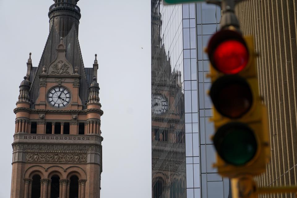 The clock tower sits above Milwaukee City Hall, Wednesday, June 14, 2023, in Milwaukee. A plan to prevent Milwaukee from going bankrupt struck between Republican lawmakers and leaders in the heavily Democratic city and Gov. Tony Evers, was up for approval Wednesday in the Wisconsin Legislature. (AP Photo/Morry Gash)