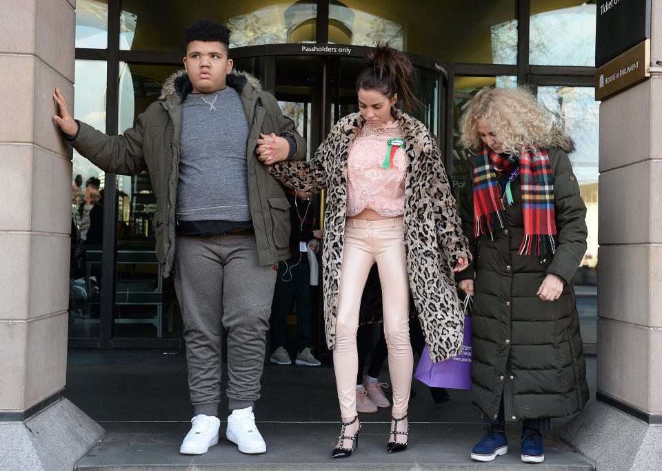 Katie Price (centre) with her son Harvey and her mother Amy leave Portcullis House in London after giving evidence to the Commons Petitions Committee where she called for online abuse to be made a specific offence. (Photo by Nick Ansell/PA Images via Getty Images)