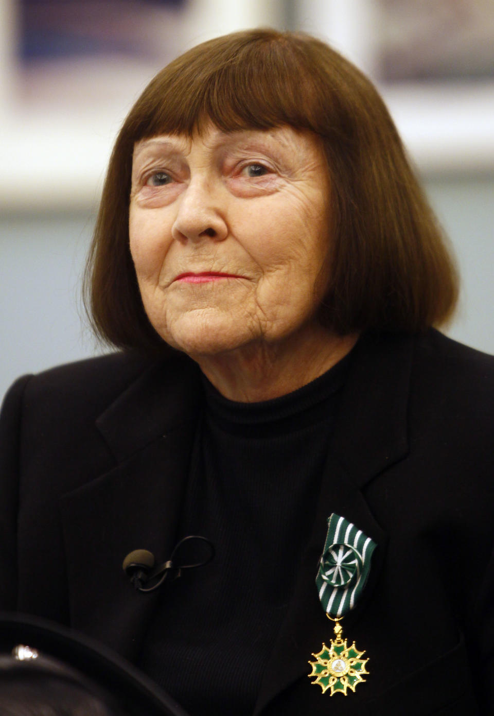 June Newton, widow of late fashion photographer Helmut Newton, recently awarded Officer of Arts and Letters, holds a news conference at the opening of Helmut Newton's first retrospective in France at Paris' Grand Palais museum, Friday March 23, 2012. The Helmut Newton exhibit, curated by his widow June Newton, contains some 250 pictures, many of which are provocative and erotically charged. His black-and-white photos were a mainstay of fashion magazines across the world for several decades, especially Vogue Paris. (AP Photo/Francois Mori)