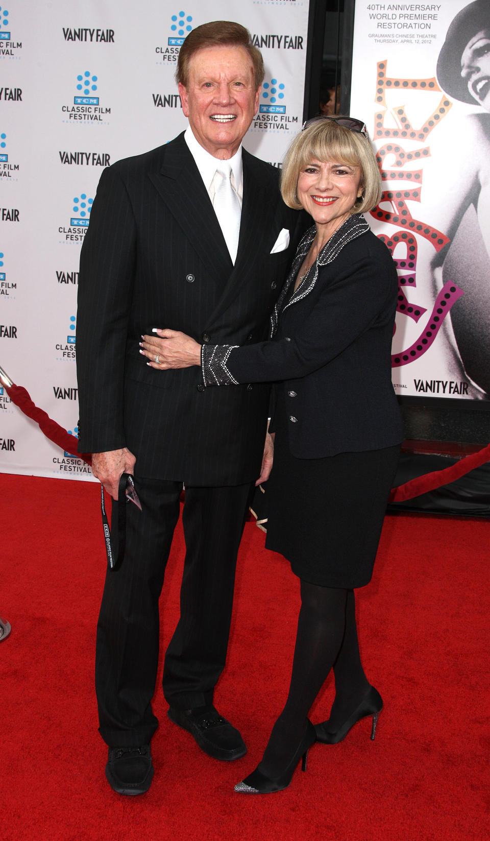 HOLLYWOOD, CA - APRIL 12: Television host Wink Martindale (L) and his wife attend the 2012 TCM Classic Film Festival Opening Night Premiere Of The 40th Anniversary Restoration Of "Cabaret" at Grauman's Chinese Theatre on April 12, 2012 in Hollywood, California. (Photo by Frederick M. Brown/Getty Images)