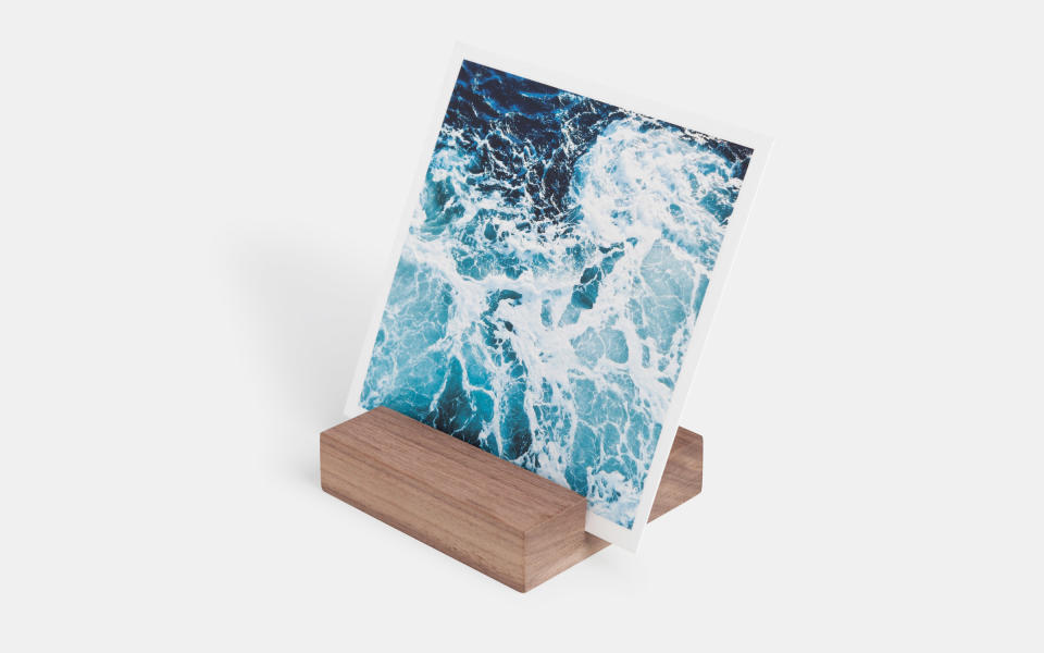 <p>This wooden block display, made of reclaimed Colorado mountain beetle pine, is beautiful and simple—without taking any attention away from the real attraction: your vacation photos, of course.</p> <p>To buy: <a rel="nofollow noopener" href="https://www.artifactuprising.com/all-photo-books-prints/wood-block-photo-prints" target="_blank" data-ylk="slk:Artifact Uprising;elm:context_link;itc:0;sec:content-canvas" class="link ">Artifact Uprising</a>, $23.99</p>