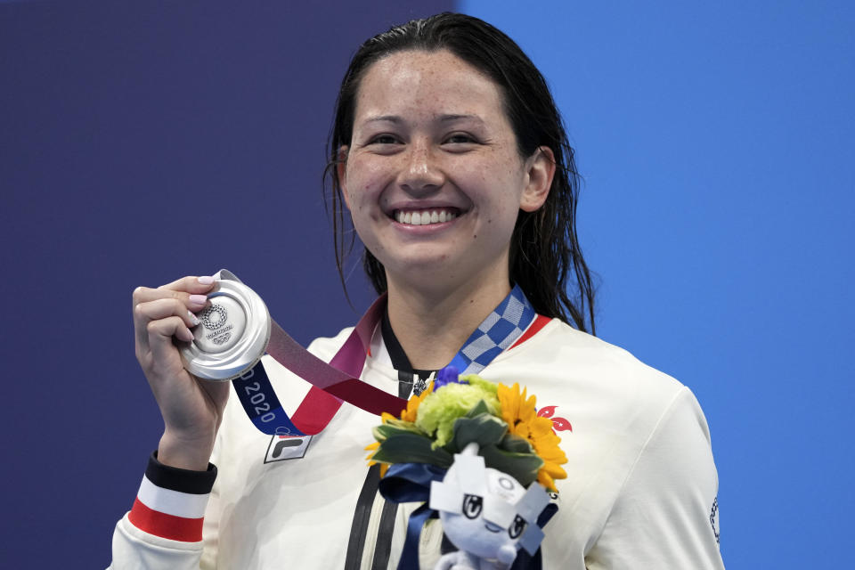 Siobhan Bernadette Haughey of Hong Kong holds up her silver medal fro the women's 200-meter freestyle final at the 2020 Summer Olympics, Wednesday, July 28, 2021, in Tokyo, Japan. (AP Photo/Matthias Schrader)