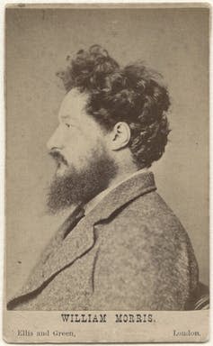 Black and white profile photo of William Morris with dark hair and beard.