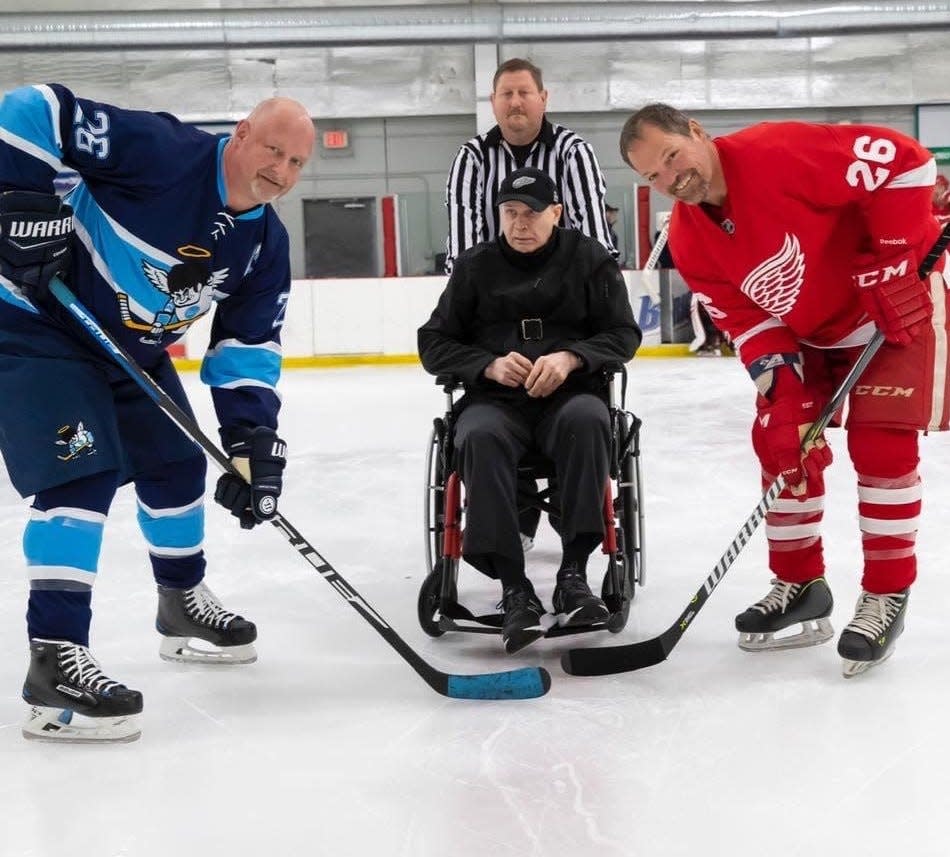 Former Detroit Red Wing defenseman Vladimir Konstantinov dropped the puck for the ceremonial faceoff at last year's Red Wings alumni game, which included Joe Kocur (26), against The Well Church in Brighton. Konstantinov will return for Sunday's edition of the game in Howell.