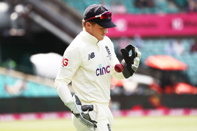 England’s Ollie Pope warms up as wicketkeeper