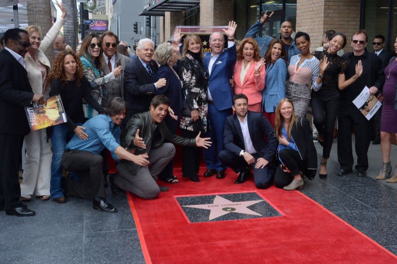 Producer Ken Corday (C) waves as he is joined by "Days of Our Lives" cast members during an unveiling ceremony honoring him with the 2,612th stair on the Hollywood Walk of Fame in Los Angeles on May 15, 2017. File Photo by Jim Ruymen/UPI