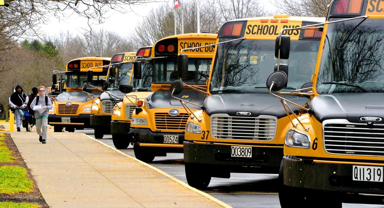 School buses line up in front of Wooster High School to transport students home.