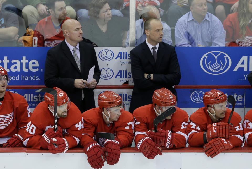 Red Wings assistant coach Pat Ferschweiler, left, and head coach Jeff Blashill watch during the third period of an NHL hockey game against the Oilers on Nov. 27, 2015, in Detroit.