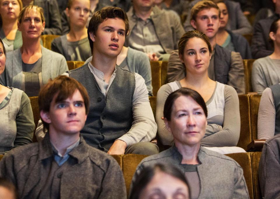 This image released by Summit Entertainment shows Ansel Elgort, second row left, and Shailene Woodley, second row right, in a scene from "Divergent." (AP Photo/Summit Entertainment, Jaap Buitendijk)