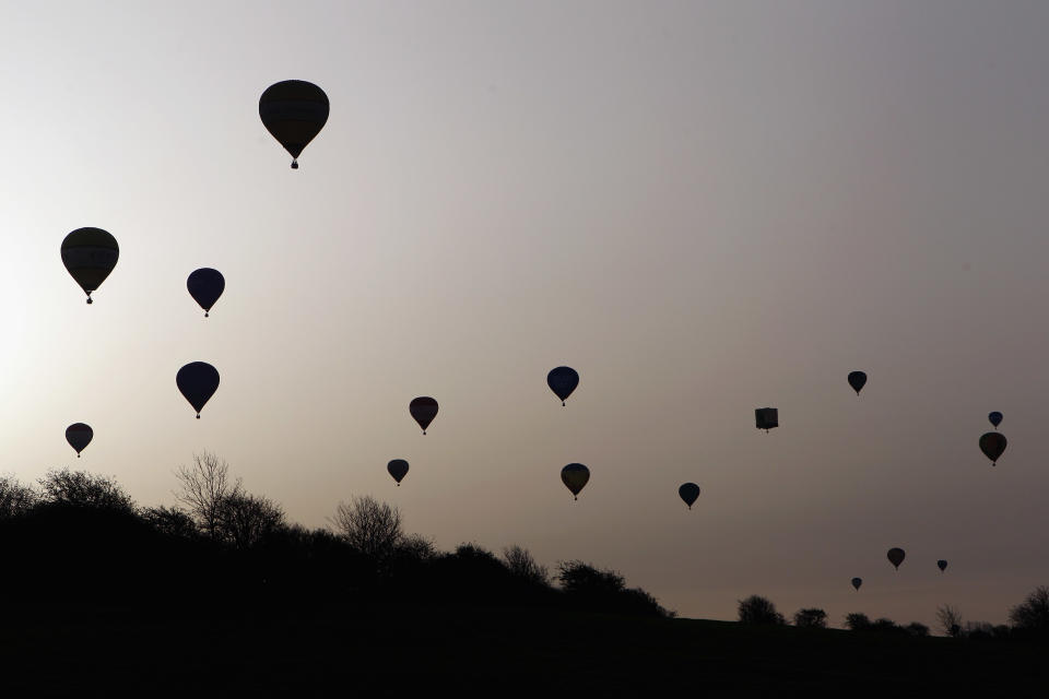 WOOTTON, UNITED KINGDOM - APRIL 07: Hot air balloons depart from Lydden Hill race circuit near Canterbury to take part in mass crossing of the Channel on April 7, 2011 in Wootton, England. 51 balloonists of various nationalities from across Europe took off from Kent making for Calais, France at about 7am. It is the first time a Guinness World Record bid has been made for "the largest group of hot air balloons to make the Channel crossing". (Photo by Oli Scarff/Getty Images)