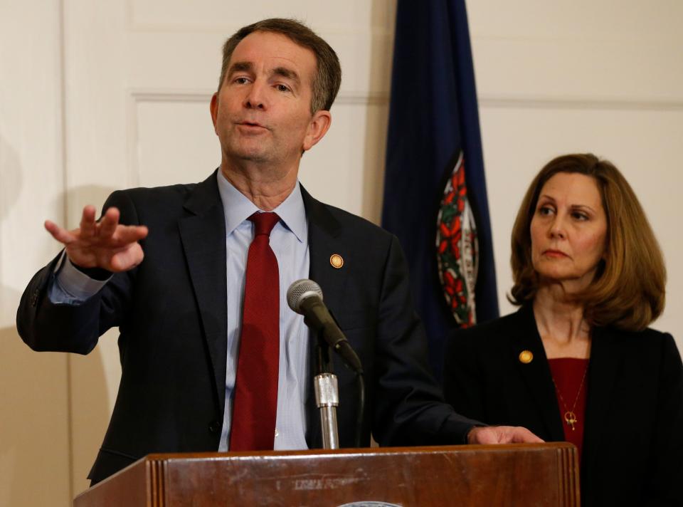 Virginia Gov. Ralph Northam, left, gestures as his wife, Pam, listens during a news conference in the Governors Mansion at the Capitol in Richmond, Va., Saturday, Feb. 2, 2019. Northam is under fire for a racial photo that appeared in his college yearbook.