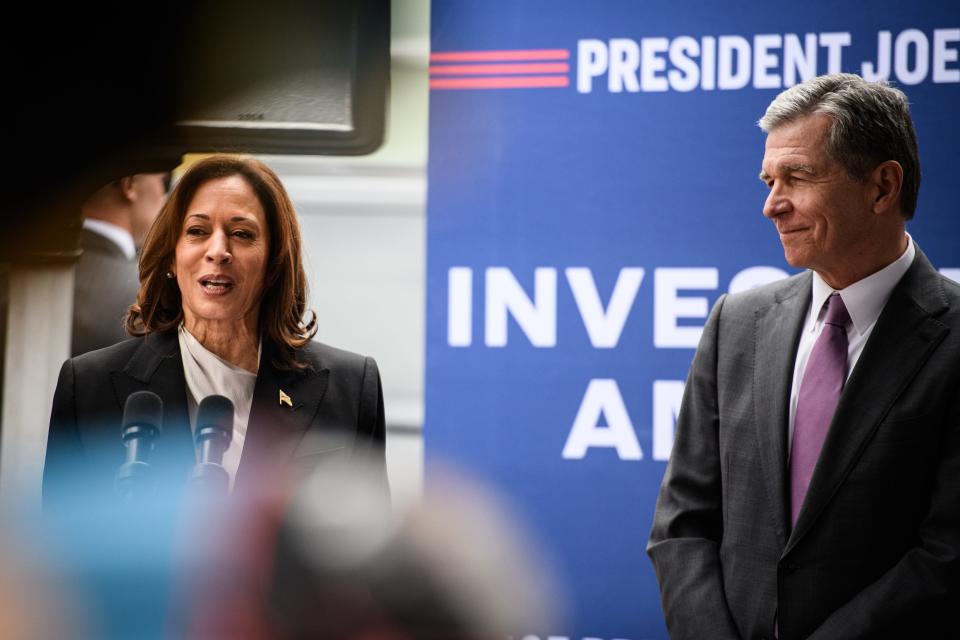 N.C. Governor Roy Cooper listens to Vice President Kamala Harris speak after visiting Ella West Art Gallery in Durham, N.C., on Friday, March 1, 2024. Harris was in Durham to announce $32 million in funds to support North Carolina-based minority entrepreneurs.