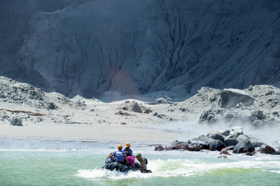 This Monday, Dec. 9, 2019, photo provided by Michael Schade shows the rescuers' boat leaving White Island following the eruption of the volcano, New Zealand. Officials say on Tuesday, Dec. 10, 2019, 47 people from New Zealand, United States, Australia, Germany, Britain, China and Malaysia were on the New Zealand volcanic island when it suddenly erupted. Of those, dozens were killed, injured or are missing. Details are scarce because conditions on the island are too dangerous for officials to return and disaster victim identification experts have only begun their work. (Michael Schade via AP)