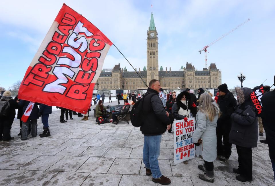 People attend the anniversary of the end of the self-styled 'Freedom Convoy' protest on Parliament Hill in Ottawa on Feb. 17, 2024.