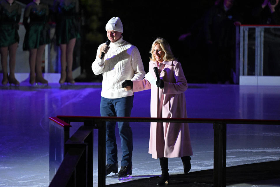 US First Lady Jill Biden (R) speaks alongside US figure skater Brian Boitano during the unveiling of the holiday ice skating rink, on the South Lawn of the White House in Washington, DC, on November 29, 2023. / Credit: MANDEL NGAN/AFP via Getty Images