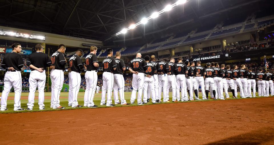 <p>Miami Marlins players wear number 16 on their jerseys in honer of Marlins starting pitcher Jose Fernandez who passed away from a boating accident over the weekend prior to the game against the New York Mets at Marlins Park. Mandatory Credit: Steve Mitchell-USA TODAY Sports </p>
