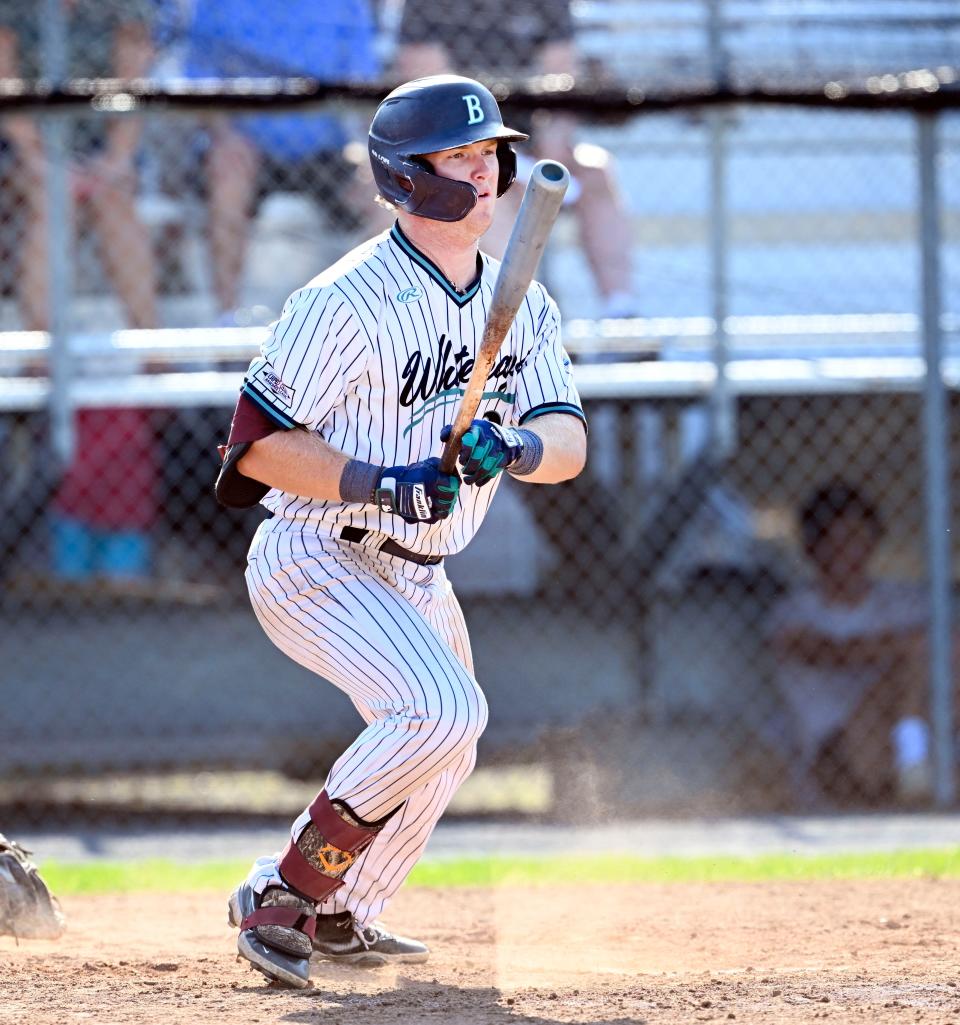 James Tibbs of Brewster brings in a run with a single against Falmouth.