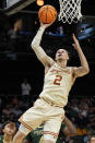 Texas guard Chendall Weaver (2) shoots against Colorado State during the first half of a first-round college basketball game in that NCAA Tournament, Thursday, March 21, 2024, in Charlotte, N.C. (AP Photo/Mike Stewart)
