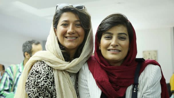 PHOTO: FILE - Journalists Nilufar Hamedi, left, and Elaheh Mohammadi. The women were among the first to report on the death of Amini, a Kurdish woman, which sparked a massive wave of protest in Iran. (Mehrdad Aladin/picture-alliance/dpa/AP Images, FILE)