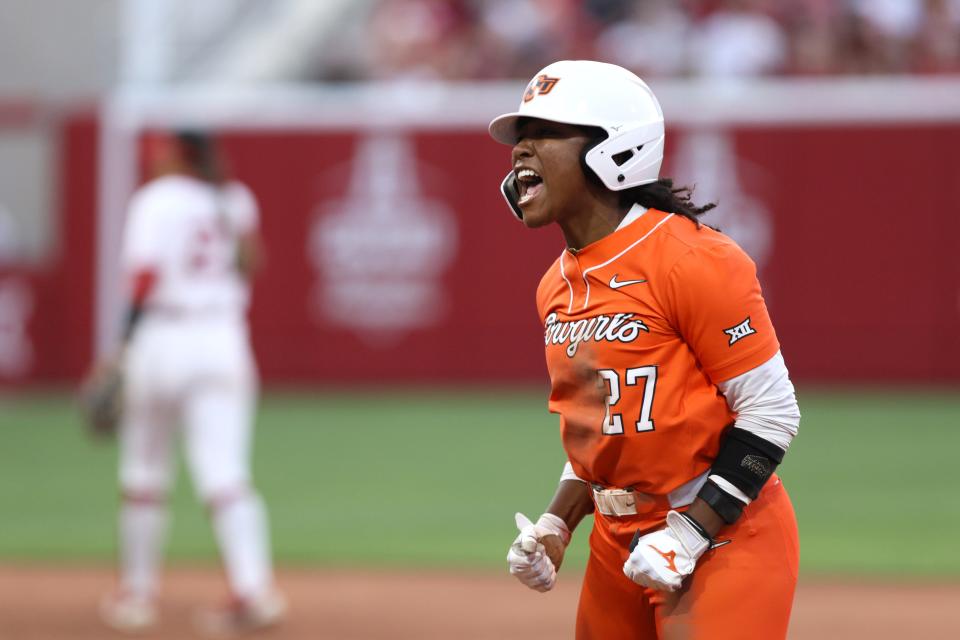 Oklahoma State's Jilyen Poullard (27) celebrates after hitting a home run n the fifth inning of a Bedlam softball game between the University of Oklahoma Sooners (OU) and the Oklahoma State Cowgirls (OSU) at Love's Field in Norman, Okla., Friday, May 3, 2024. Oklahoma State won 6-3.