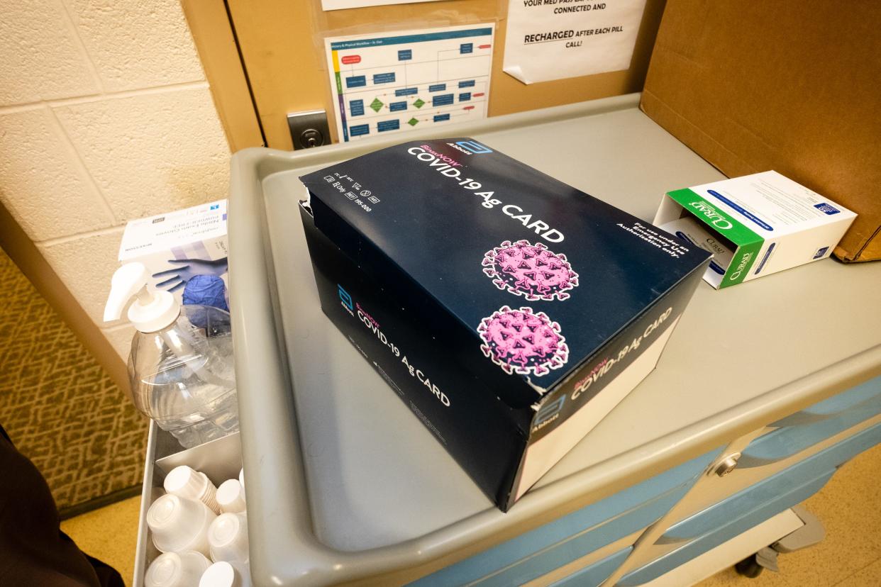 A COVID-19 rapid test kit sits in a box in the St. Clair County jail.
