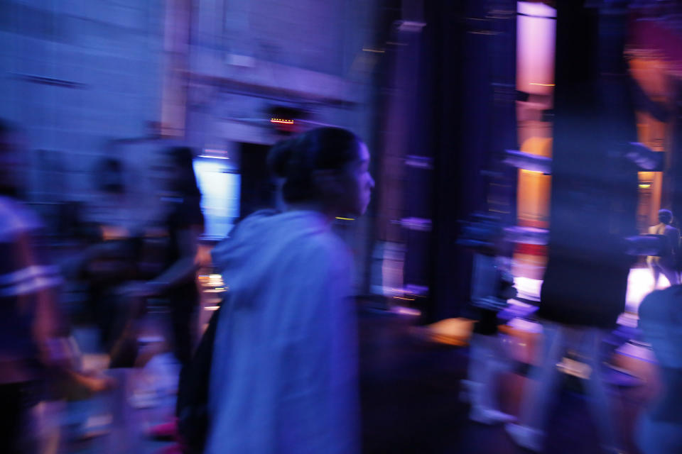 Paola Nava, 17, walks backstage during a rehearsal of Vladimir Issaev's rendition of The Nutcracker ballet on Friday, Dec. 13, 2019, in Fort Lauderdale, Fla. More than 20 dancers of Venezuelan origin were playing various roles on a recent performance of the holiday favorite “The Nutcracker.” Some of these dancers are here seeking asylum after fleeing their crisis-torn nation, which is plagued by shortages of food and medicine. (AP Photo/Brynn Anderson)