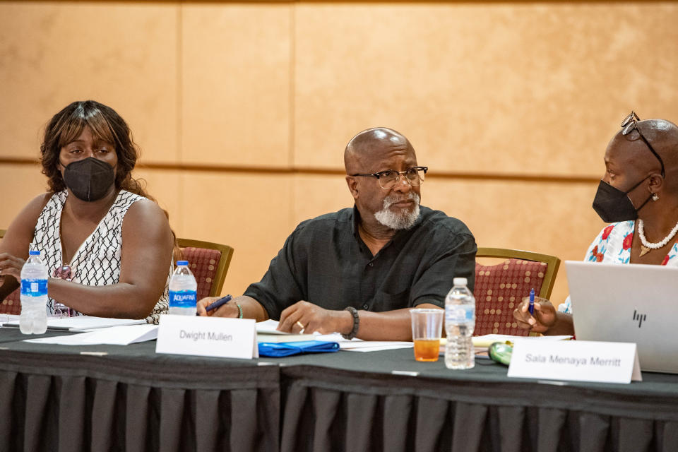 Chairman Dwight Mullen listens to committee members during a Community Reparation Commission meeting on June 6, 2022.