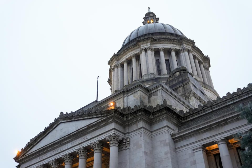 FILE -The Capitol building is seen on the first day of the legislative session at the Washington state Capitol Monday, Jan. 8, 2024 in Olympia, Wash. Democratic Sen. Yasmin Trudeau, a Washington state lawmaker wants to prohibit police from hog-tying people, nearly four years after Manuel Ellis died facedown with his hands and feet cuffed together behind him in a case that became a touchstone for racial justice demonstrators in the Pacific Northwest. (AP Photo/Lindsey Wasson, File)