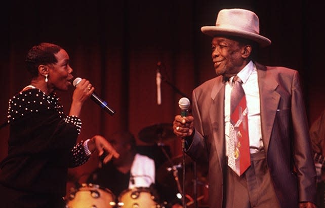 Zakiyah Hooker (left) performs with her father, John Lee Hooker, in 1998.