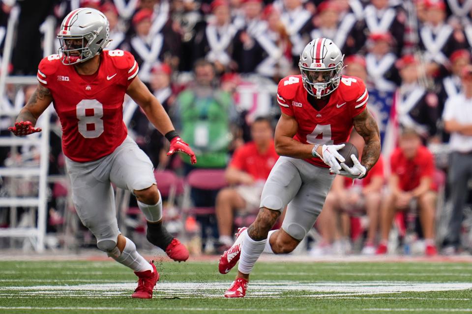 Ohio State receiver Julian Fleming gets a block from tight end Cade Stover against Western Kentucky.
