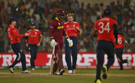 Cricket - England v West Indies - World Twenty20 cricket tournament final - Kolkata, India - 03/04/2016. England's David Willey (C) celebrates taking the wicket of West Indies Lendl Simmons. REUTERS/Adnan Abidi