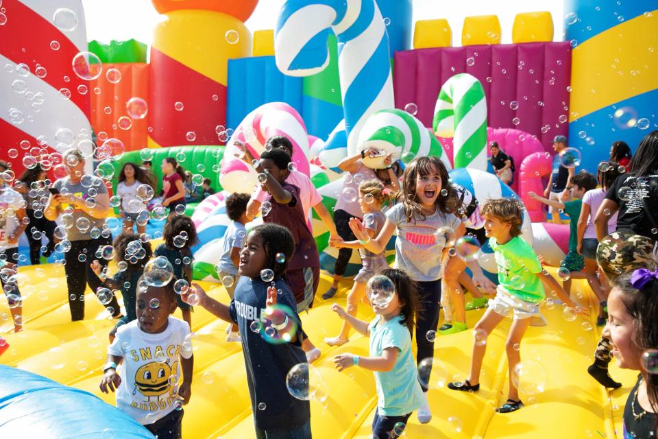 The Big Bounce America bounce house experience includes foam and bubble parties.